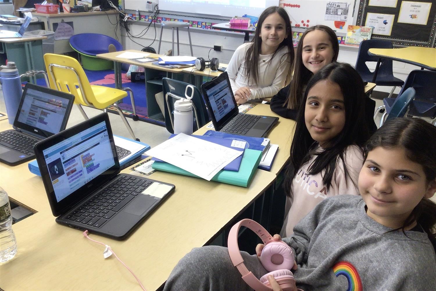 girls in front of computers